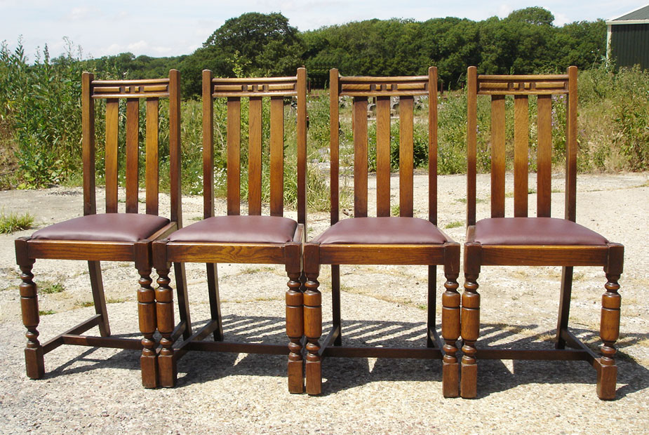 Set of four oak upholstered pub chairs
